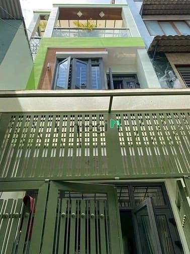 Bán nhà mới 2 lầu ,sân thượng gần chợ tân bình