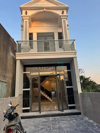 Bán Nhà 1 Trệt 1 lầu sân xe hơi, đường nhựa, nhà mới